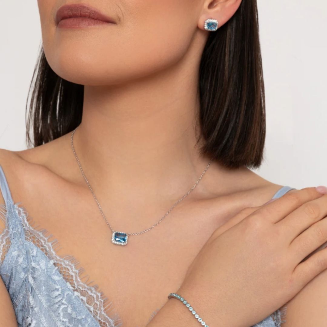 KNIGHT & DAY HORIZONTAL LIGHT BLUE CRYSTAL EARRINGS